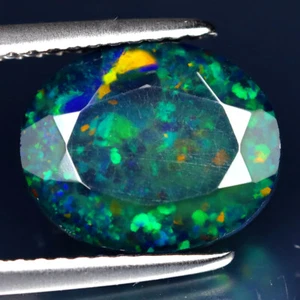2.30 ct Phenomenal Oval (11 x 9 mm) Flashing 360 Degree Multicolor Black Opal - Picture 1 of 2