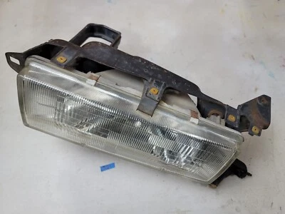 85-87 Toyota Cressida Driver Left Side Headlight and Lamp Mounting Bracket - Image 1 of 2