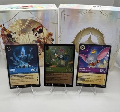 LORCANA FABLED GOOFY D23 EXCLUSIVE, DUMBO & HADES  DISNEY LORCANA - Image 1 of 2