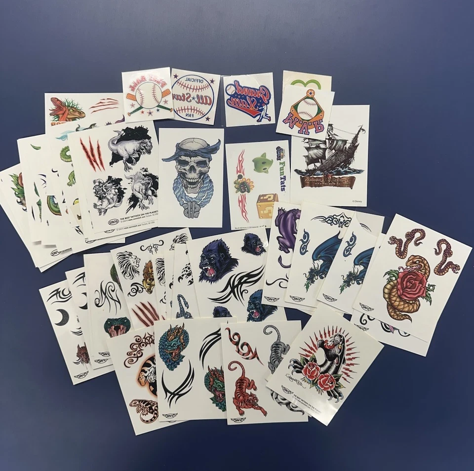 ENORME LOTE DE TATUAJES TEMPORALES ED HARDY SAVVI ANIMALES DINOSAURIOS BÉISBOL PIRATAS Foto 1 de 1