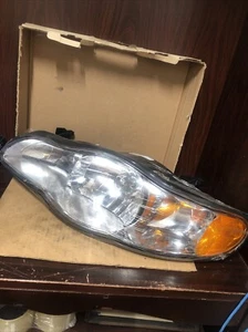 New Old Stock TYC Headlight LH Drivers Side Part #20-5916-00. - Picture 1 of 15