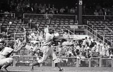 Chicago Cubs shortstop Ernie Banks swings a pitch during a game- 1962 Old Photo