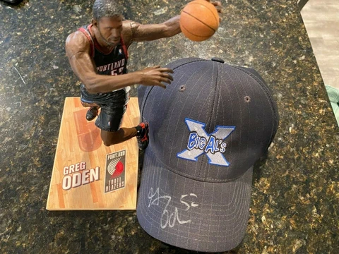 Greg Oden Autographed Hat & 2007 McFarlane Portland Trail Blazers Action Figure Cover