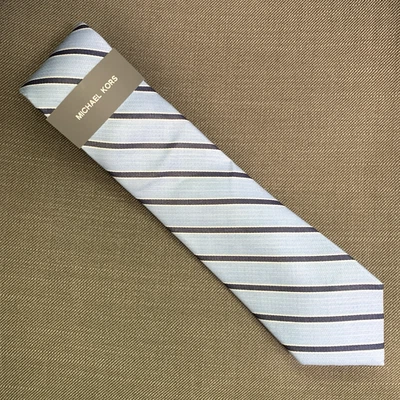 Corbata para hombre Michael Kors azul a rayas de neptuno mezcla de seda precio de venta sugerido por el fabricante 69,50 USD Foto 1 de 3