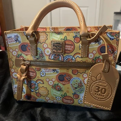 Dooney And Bourke 2025 Epcot Flower And Garden Orange Bird Crossbody Bag NWT - Image 1 of 4