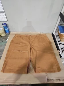 Salopette Carhartt marrone ampia tela d’anatra falegname pantaloni da lavoro uomo 54x30 nuova con etichetta - Foto 1 di 7