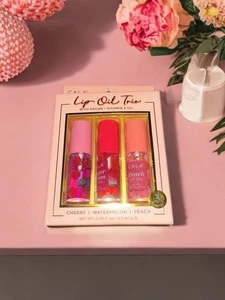 CALA Lippenöl Trio Kirsche Wassermelone Pfirsich feuchtigkeitsspendender Glanz Argan Vitamin E - Bild 1 von 4