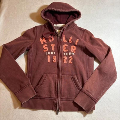 Hollister Sudadera con Capucha Cremallera Completa Mujer Mediana Borgoña Surf Team 1922 Informal Y2K Foto 1 de 4