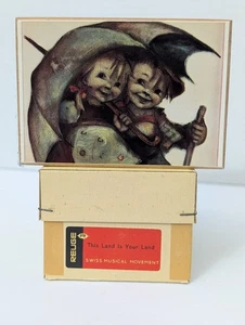 Music box vintage Reuge movimento musicale svizzero legno questa terra è la tua terra - Foto 1 di 5