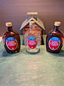 (3) VINTAGE LOG CABIN 24 oz  GLASS SYRUP BOTTLES BICENTENNIAL  1776-1976 + CABIN - Picture 1 of 11