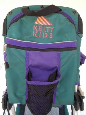 Kelty Kids Carrier Town Style # 21959040 marco de metal púrpura/verde usado en excelente estado Foto 1 de 4