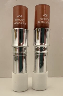 2 X LÁPIZ LABIAL CLINIQUE BUTTER SHINE #406 DELOVELY 0,14 OZ. GORRA BLANCA Foto 1 de 2