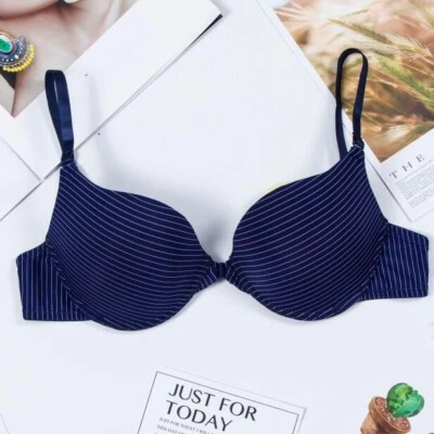 Sujetador de pecho pequeño sin costuras Sujetador de moda Sexy Sujetador con botones delanteros Ropa interior push up  Foto 1 de 4