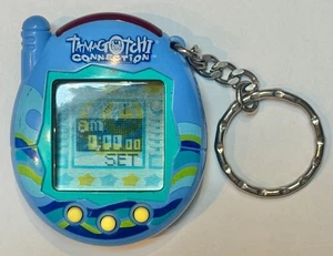 Vintage 2004 Tamagotchi Connection V3 w/Battery (Blue w/ Surf shell design) - Picture 1 of 2