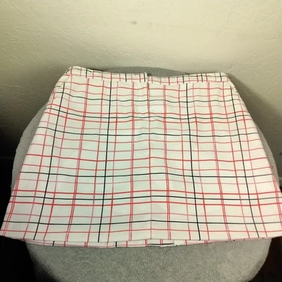 Falda corta de golf Izod talla 12 blanca rosa a cuadros bolsillos geométricos cremallera rendimiento Foto 1 de 4