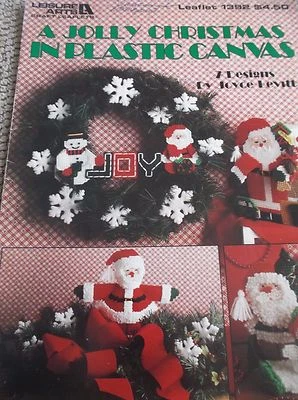 PLASTIC CANVAS PATTERN A JOLLY CHRISTMAS 7 DESIGNS SANTA SNOWFLAKES SNOWMAN - Image 1 of 2