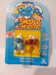 Die Schlümpfe - Poseable Figure - Toy Island - 1996 ungeöffnet Filmemachen Schlumpf - Bild 1 von 3