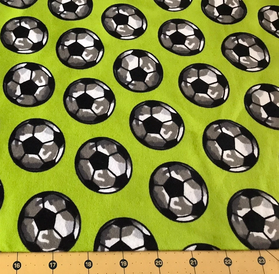 Soccer on Green Flannel Fabric Sold By The Yard #2171 - Image 1 of 1
