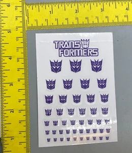 Pegatinas de reproducción Decepticon Transformers etiquetas sellos símbolos púrpura - Imagen 1 de 1