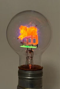 VINTAGE WORKING AEROLUX NEON LIGHT BULB WITH RAM JUMPING A FENCE NOS - Picture 1 of 3