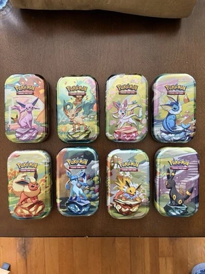 NO PACKS Pokémon Prismatic Evolutions Mini Tins Set of 8 With Coins & Art Cards - Imagen 1 de 2