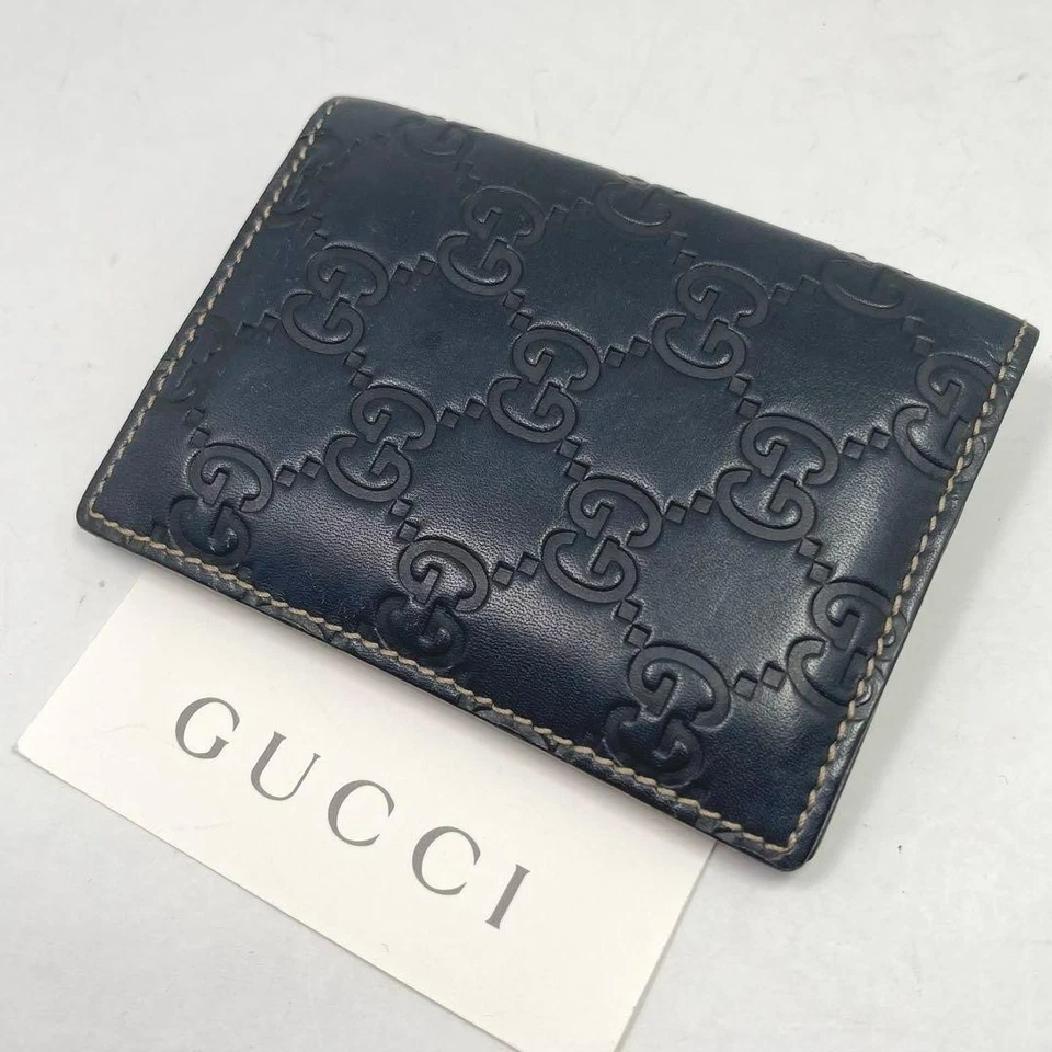 Tarjetero Gucci Doble Plegable Cuero Negro Unisex Hecho en Italia GG Check Foto 1 de 4