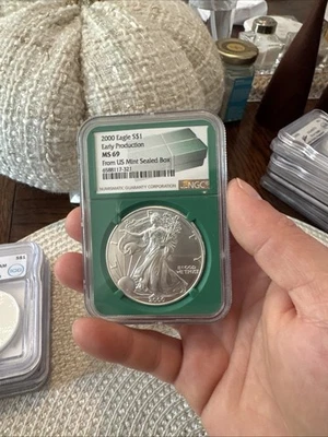 2000 SILVER EAGLE NGC MS69 EARLY PRODUCTION FROM US MINT SEALED BOX GREEN CORE - Image 1 of 2
