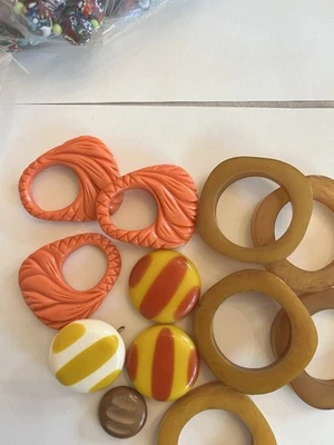 Lot of Bakelite Buttons and Napkin Rings Various Sizes Coral And Yellows - Image 1 of 4