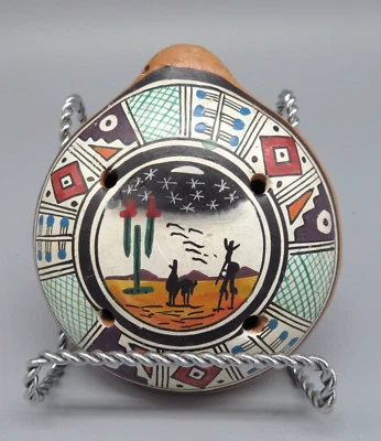 Instrumento musical hecho a mano Ocarina de cerámica roja silbato de arcilla pintado a mano Foto 1 de 4