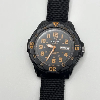 Casio Watch Mens 42mm Black Orange 5125 MRW-200H 100M Day Date  - Image 1 of 4