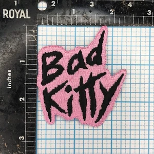 BAD KITTY PINK BLACK TEXT LOGO COMIC NOVELTY BIKER 2.75" IRON ON CLOTH PATCH - Picture 1 of 2