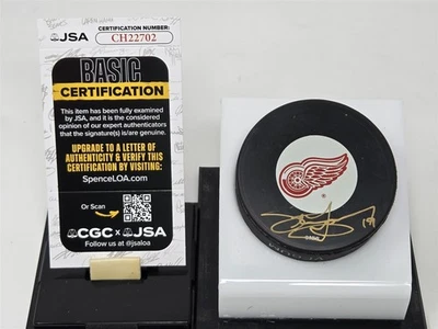 STEVE YZERMAN signed RED WINGS puck JSA COA - Image 1 of 2
