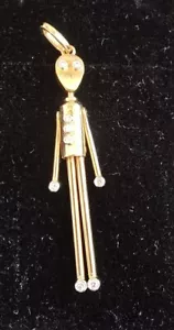 Statuina bastone articolato VINTAGE ORO 18k 9 DIAMANTI (3 bambini sul petto) - Foto 1 di 6