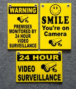 (3)  24 HOUR VIDEO SURVEILLANCE SMILE YOU'RE ON CAMERA SECURITY SIGNS 8x12   NEW - Picture 1 of 1