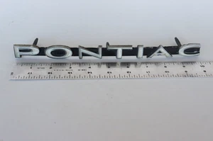 OEM #9780163 Vtg 1965 PONTIAC GTO / LEMANS GRILL EMBLEM Script NAMEPLATE - Picture 1 of 12