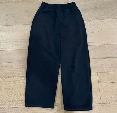 Pantalones deportivos Uniqlo negros holgados talla XS para hombre con bolsillos traseros cordón cintura Foto 1 de 3