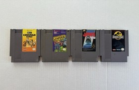 Nintendo NES 4 game lot - Caveman Games, Monster Party, Jaws, Jurassic Park