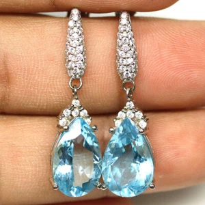 925 Sterling Silver 10 x 15 mm. Sky Blue Topaz & White Zircon Earrings - Picture 1 of 4