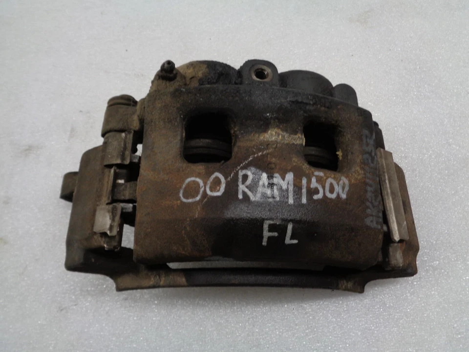 Pinza de freno delantera izquierda del lado del conductor Dodge Ram 1500 Van 2000-2002 OEM AK2411252 Foto 1 de 4