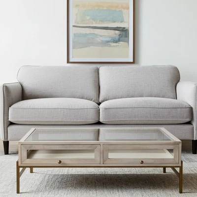 Mesa de centro de almacenamiento de hierro y vidrio macizo transparente y dorado blanco roto de 44" Foto 1 de 4