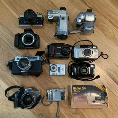 Lote de 12 cámaras Fujifilm/Coolpix/Olympus/Nikon y más SIN PROBAR PARA REPUESTOS Foto 1 de 4