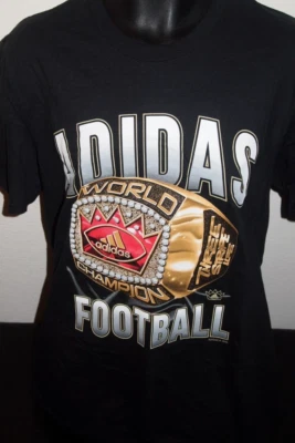 NUEVO CON ETIQUETAS Adidas Campeones Mundiales de Fútbol Fútbol Anillo Negro Camiseta Talla Hombres XL Foto 1 de 3