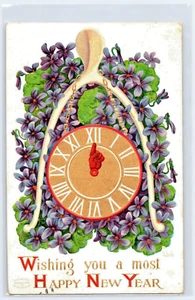 Antigua postal de Año Nuevo publicada en relieve flores y reloj (1902) - Imagen 1 de 2