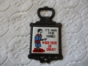 Vintage Cast Iron Bar Trivet Bottle Opener "It's Hard To Be Humble" - Picture 1 of 8