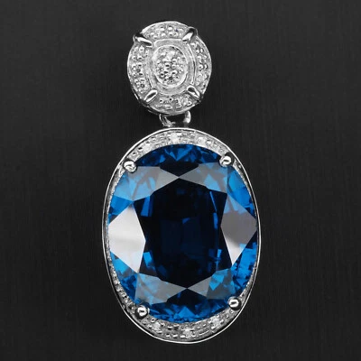 Exquisitos colgantes hechos a mano de plata de ley 925 ovalados de circón azul intenso de 19,30 quilates Foto 1 de 4
