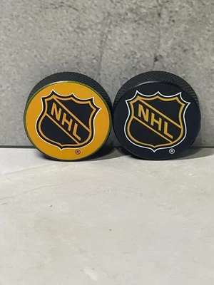 NHL Hockey Mini Rubber Hockey Pucks lot of (2) - Image 1 of 2