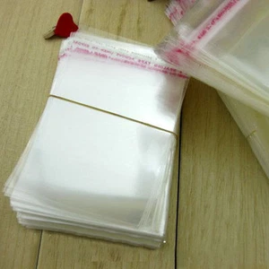 Bolsas de celofán transparentes fuertes para exhibición de prendas autoadhesivas sellado de plástico OPP - Imagen 1 de 4