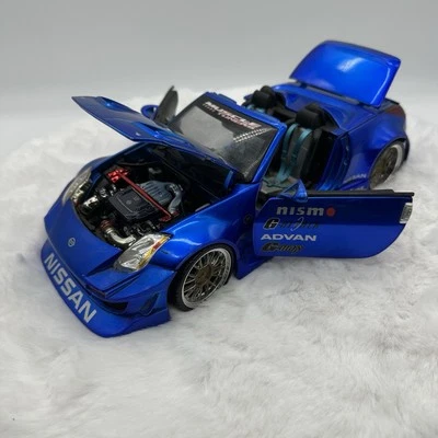 Muscle Machines Tuners 2004 NISSAN 350Z NISMO Blue Convertible 1:18 Scale Car - Image 1 of 4