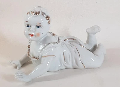 Vintage German Style Unsigned Painted White & Gilded Porcelain Piano Baby Figure - Image 1 of 4