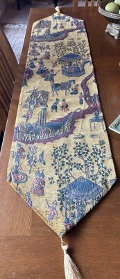Chenille Thai Village Table Runner.  55”.  Golds, Blues, Greens. Gold Tassels.  - Image 1 of 4